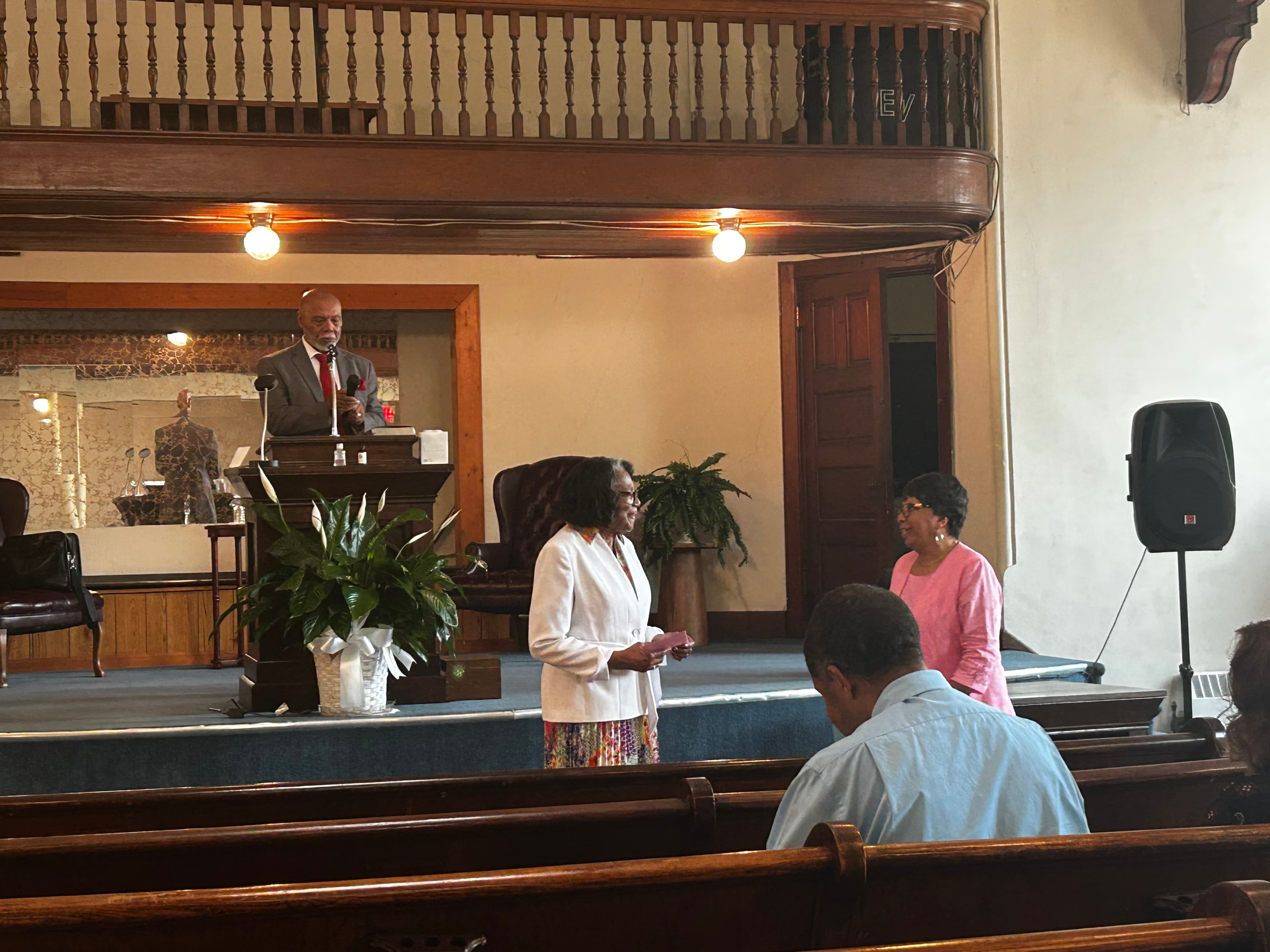 Bishop Smith leading the Mother's Day service from the pulpit
