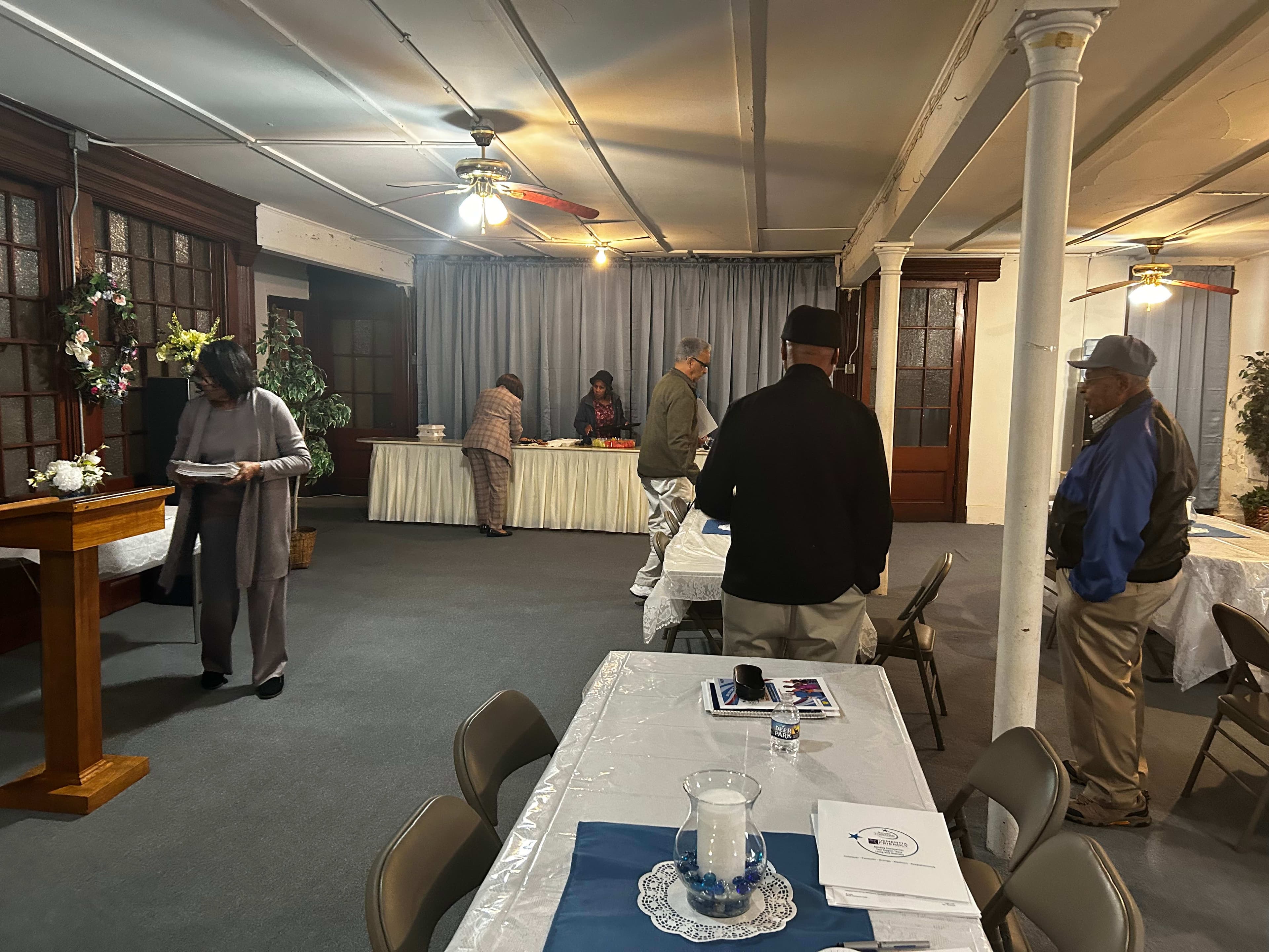 Attendees gathering for refreshments after the training